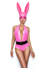 Canvas Print - Sexy blonde woman posing in latex pink costume and pink bunny mask on white background. Easter bunny concept. Latex lingerie. Naughty girl. Halloween costume. Lingerie fashion.