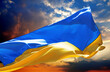 Flag of Ukraine waving on sunset peaceful sky with danger clouds