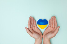 Heart With Print The National Flag Of Ukraine In Female Hands. Flat Lay. Copy Space.