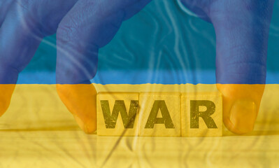 Wall Mural - War word on wooden cube. Ukrainian flag