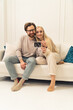 © PoppyPix - vertical photo of extremely happy two people in a relationship holding an ultrasound picture of their future baby. High quality photo