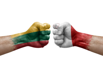 Two hands punch to each others on white background. Country flags painted fists, conflict crisis concept between lithuania and malta