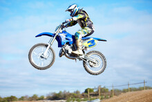 Hes A Crowd Pleaser. A Motocross Rider In The Air During A Jump.
