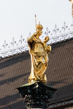 Low Angle View Of Gold Mother And Child Statue