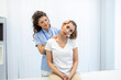 © Graphicroyalty - Female physiotherapist or a chiropractor adjusting patients neck. Physiotherapy, rehabilitation concept. White background front view with copy space