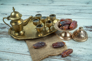 Wall Mural - Ramadan concept: Dates, zam zam water on a wooden table