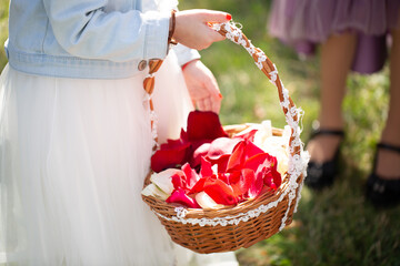 Canvas Print - Children with a basket throwing rose petals at a wedding