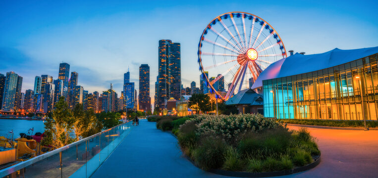chicago,illinois,usa. 08-15-17: beautiful navy pier at dusk with chicago skyline.
