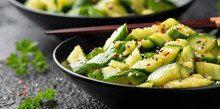 Smashed Cucumber Spicy Asian Style Salad With Soy Sauce Dressing, Chilli Flakes, Garlic And Sesame Seeds