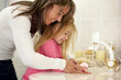 © T Hover/peopleimages.com - Its so important to wash your hands.... Shot of a mother teaching her daughter how to wash her hands.