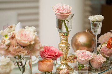 Wall Mural - Table setting at a luxury wedding and Beautiful flowers on the table. wedding decor, flowers, pink and gold decor, candles.