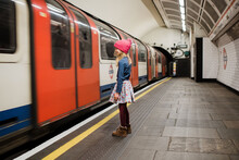 Girl Waiting For The Underground Train In London