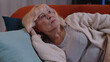 © Andrii Iemelianenko - Portrait of scared tired elderly woman wakes up from nightmare in bedroom at home. Poor bad sleep of senior aged grandmother, stress, nervousness, anxiety, mental health. Loneliness Sickness Headache