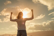 © kieferpix - Strong and determined young woman flexing her arms up to the sunset sky. People power, and strength concept