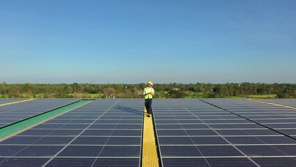 Wall Mural - professional engineer using drone and digital tablet maintaining solar cell panels together on build
