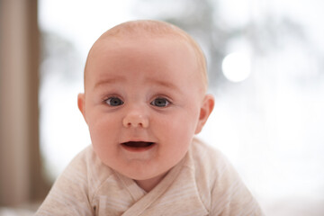 Wall Mural - Im all about the cuteness. Shot of a cute and adorable baby boy at home.