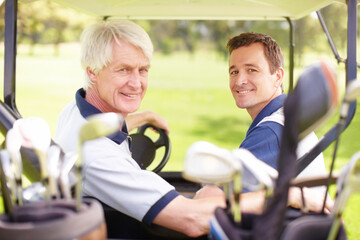 Golfing buddies. Golfing companions on the golf course in a golf cart.