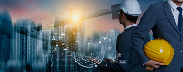 Future building construction engineering and technology project concept. double exposure graphic with engineer using digital tablet and smart industry and IOT software to control operation.