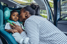 Mother Kissing Her Son In Car