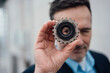© Westend61 - Businessman looking through an object