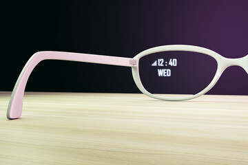 Aufkleber - Close up of augmented reality glasses on wooden desk and purple background. Technology and future concept. 3D Rendering.