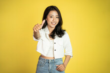 Smiling Young Woman Stand With Thumbs Up On Isolated Background