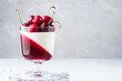 Delisious panna cotta summer dessert with cherries and cherry jelly