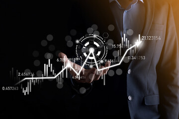 Businessman in hand hold banking business finance graph and invest in stock market investment point,economic growth and investor concept.analysis virtual stock market chart,analyze by use technology