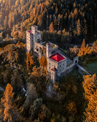 Wall Mural - Latzfons, Italy - Aerial view of beautiful Gernstein Castle (Castello di Gernstein, Schloss Gernstein) at sunrise in South Tyrol at autumn