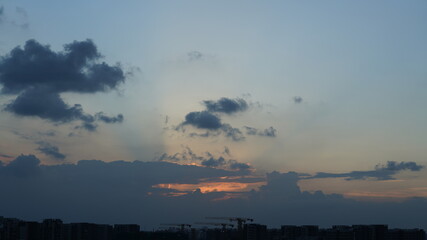 Wall Mural - the beautiful sunset view with the colorful clouds and sky in the city