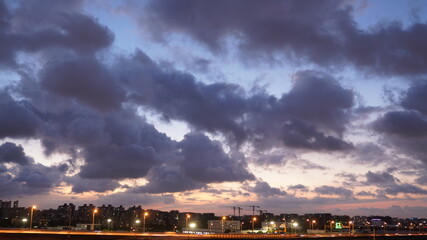 the beautiful sunset view with the colorful clouds and sky in the city