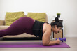 © Chanakon - Young asian sport woman plus size sitting practicing yoga lesson. Stretching  training workout on yoga mat at home for good health and body shape.