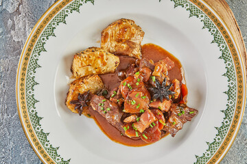 Sticker - Beef casserole in beer on board on wooden stand