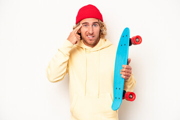 Wall Mural - Young skater caucasian man isolated on white background showing a disappointment gesture with forefinger.