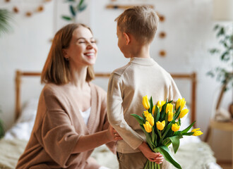 Wall Mural - cheerful mother with bouquet thanks son