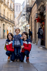 Poster - Cute little children tourists admiring Barcelona city, family travel with kids