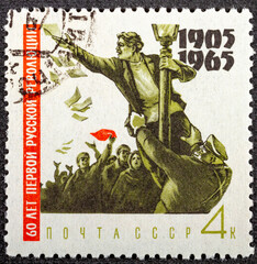 Wall Mural - RUSSIA - CIRCA 1965: A stamp printed in the USSR CCCP, Soviet shows a soldier attacking a leaflet distributor to the 60th anniversary of the revolution of 1905. Around 1965