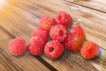 Fresh red raspberries with green leaf