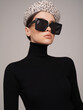 Beautiful young lady in a black turtleneck