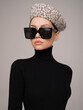© soup studio - Beautiful young lady in a black turtleneck