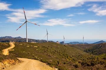Wall Mural - turbines in a mountain wind farm. ecological energy production.
