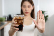 women avoid to eat soft drink and junk food.