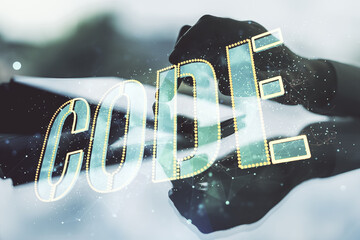 Poster - Creative Code word sign and finger clicks on a digital tablet on background, international software development concept. Multiexposure