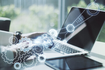Aufkleber - Double exposure of robotics technology hologram and hands typing on laptop on background. Research and development software concept
