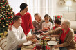 © New Africa - Happy family enjoying festive dinner at home. Christmas celebration