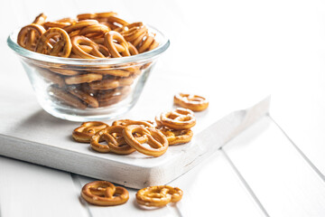 Wall Mural - Mini pretzels. Crusty salted snack in bowl.