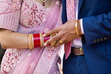 Indian couple's holding hands close up