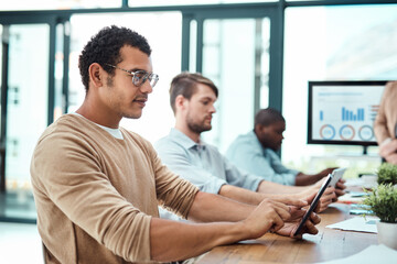 Poster - Making moves with the right tools. Shot of a group of businesspeople working in an office.