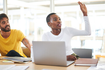 Poster - Ask more questions, gain more clarity. Shot of a young businesswoman raising her hand to ask a question during a meeting in a modern office.