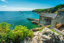 The Lizard Peninsula Lifeboat Shed And Ramp Into Sea,,clifftop And Rocky Cove In Summertime,southern Cornwall, England, United Kingdom.
